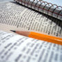 Homework Help Photograph of a pencil resting on a dictionary