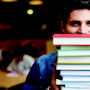 Creative Writing Workshop Photograph of man holding books
