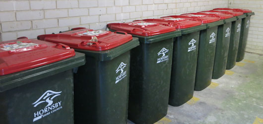Row of red lidded bins