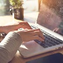 eSmart Survey Photo of hands typing on a laptop