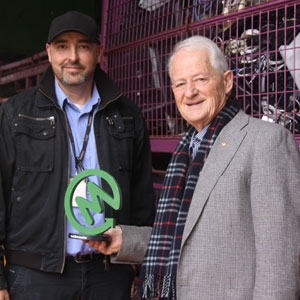 Hornsby Shire Council’s Mayor, Philip Ruddock, and Benn Judkins (Operations Co-ordinator for Waste and Cleansing  - wearing cap) with MobileMuster 2021 trophy.   