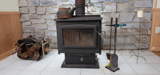 wood burner heater against wall