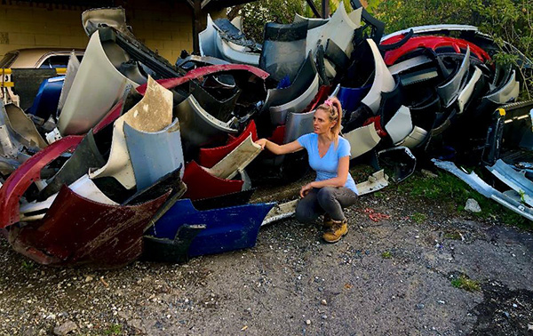 Female in front of plastic bits