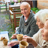 elderly enjoying coffee outdoors