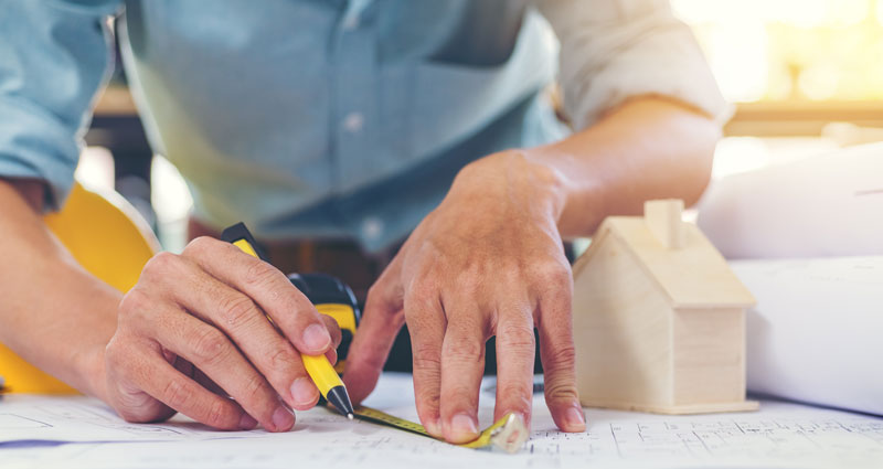 engineer measuring with ruler