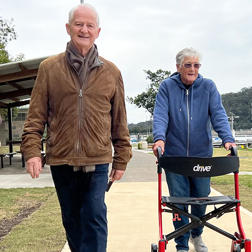 Mayor Ruddock walking alongside elderly lady