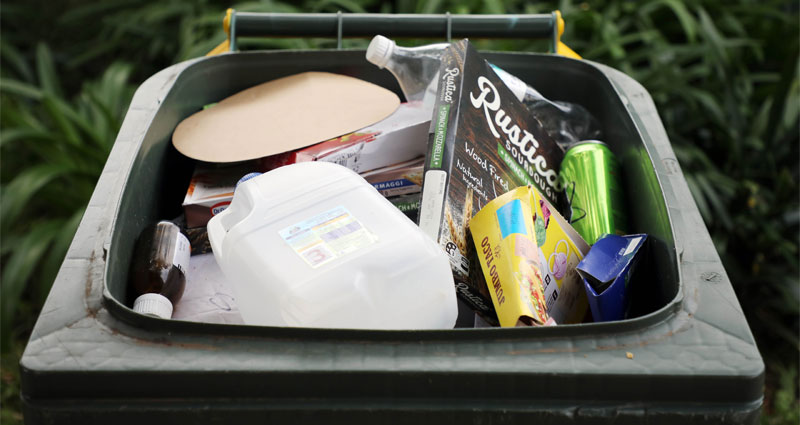 recyclable items in yellow lid recycling bin