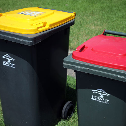 red and yellow lid garbage bins