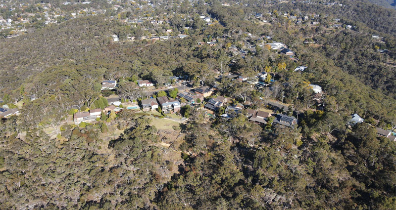 aerial of house surrounded by bush