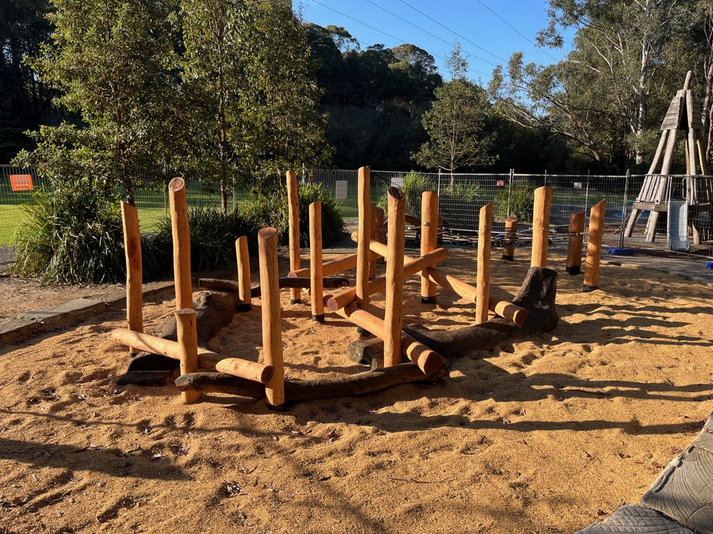 assembly of wooden poles in playground