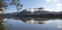 <strong>© Verne Mantova – Hawkesbury River Wisemans Ferry</strong><br>I walk often along my road which is adjacent to the Hawkesbury River where this photo was taken in Wisemans Ferry. I also observe how the river and surrounds change through the seasons. I took this photo as the reflections on the water at the time were particularly beautiful. They also show the renewal of the bush post the November December bushfire 2019.