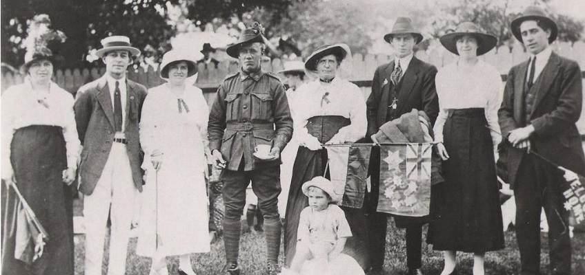 Photograph of a family welcoming home their Australian war hero son and brother in 1919