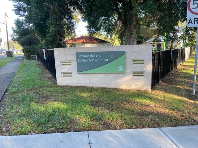 Wall with signage - Hawkins Hall and Children's Playground