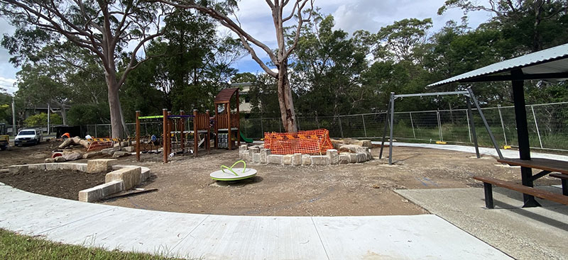 playpark with nature play and play equipment