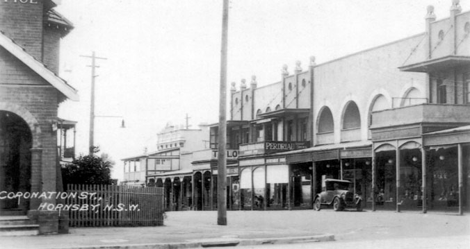 old buildings in Coronation Street Hornsby, with car in background