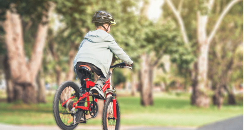 young boy riding bike