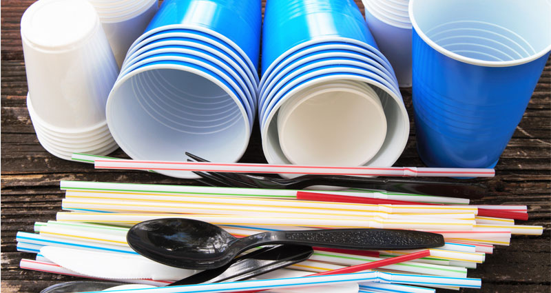 plastic cups, straws and cutlery