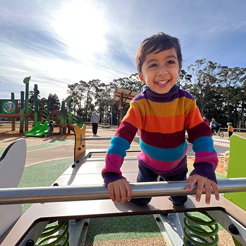 child on play equipment