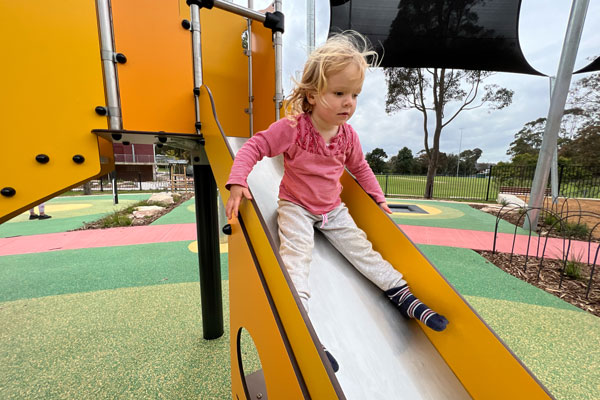 young girl on slide