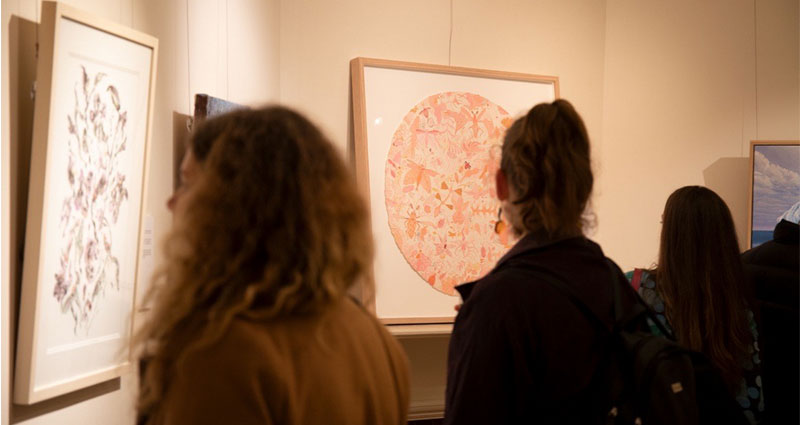 ladies viewing art in gallery