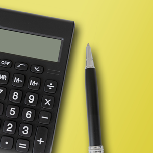 calculator and pen on yellow background