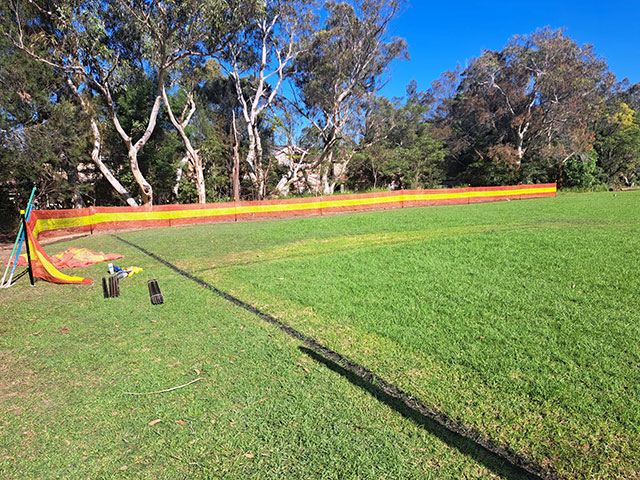 grassy area fenced off