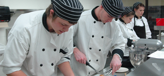 Staff working in a commercial kitchen