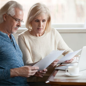 older couple looking at utilities