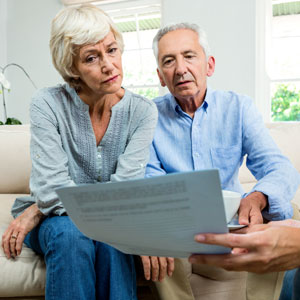 Older couple with legal document