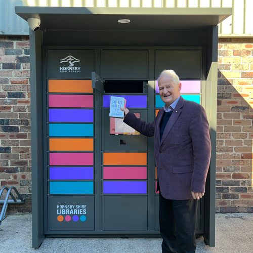Hornsby Shire Mayor, Philip Ruddock using Berowra book locker