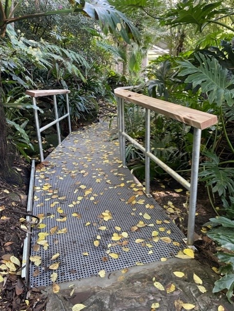 footpath with handrails leading into garden