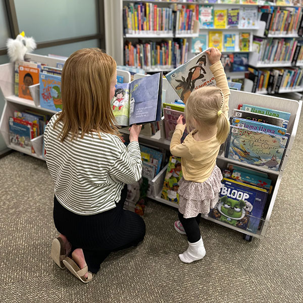 A parent and child explore the new children's area in Berowra Library