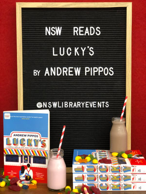 Blackboard with milkshakes and books