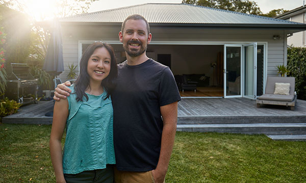 couple in front of home