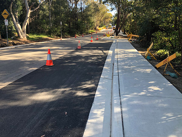 concrete path alongside road