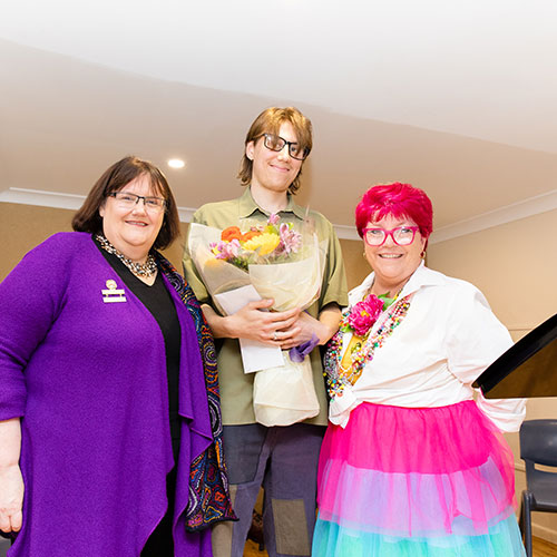 Solomon Karmel-Shann (centre) with Councillor Janelle McIntosh (left) and Councillor Sallianne McClelland (right).