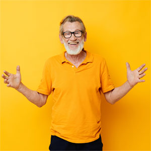 male in orange teeshirt standing with arms outstretched
