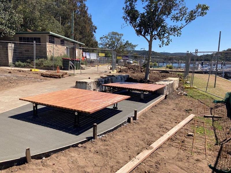 tables with tree in background