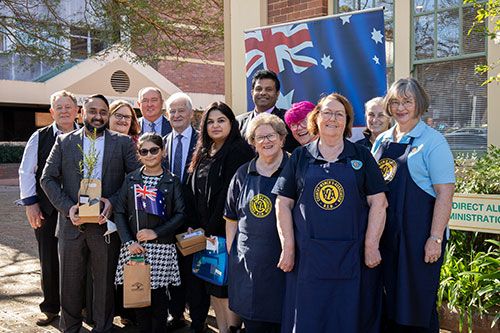 group in front of building with Australian flag