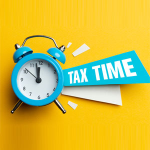 tax time clock on yellow background