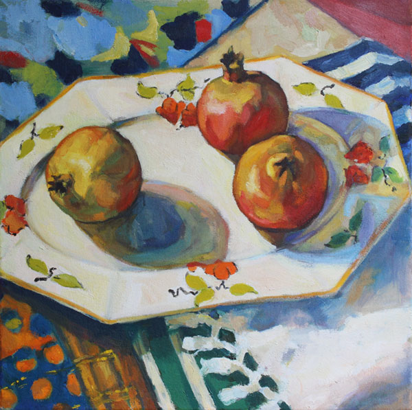 painting of pommegranates on coloured plate on table