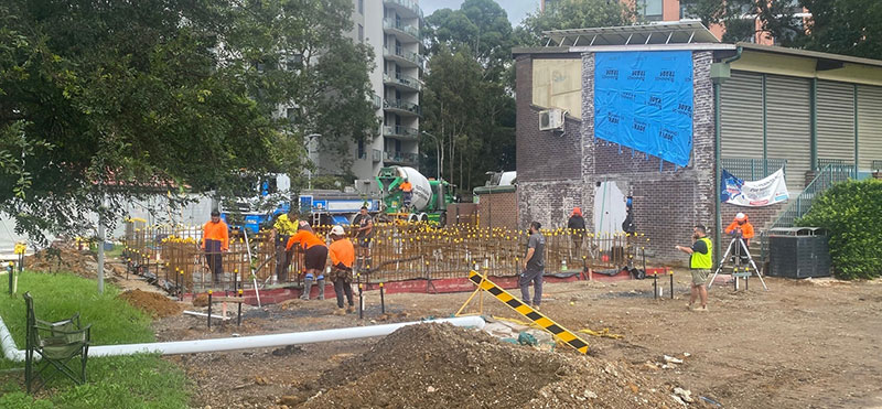 workers on ground performing ground preparation
