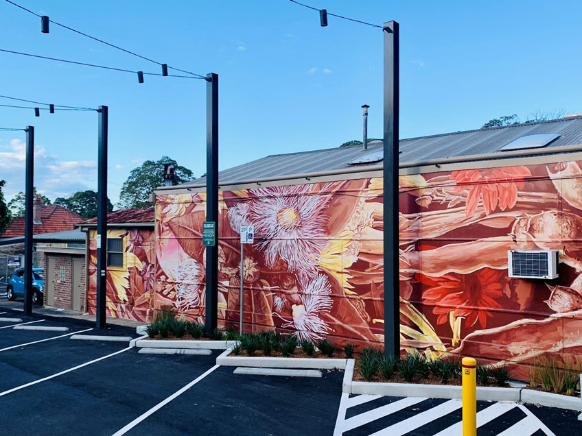 native mural over car park