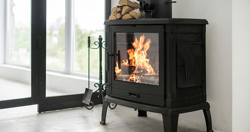 Fireplace at lounge room standing on concrete floor with copy space