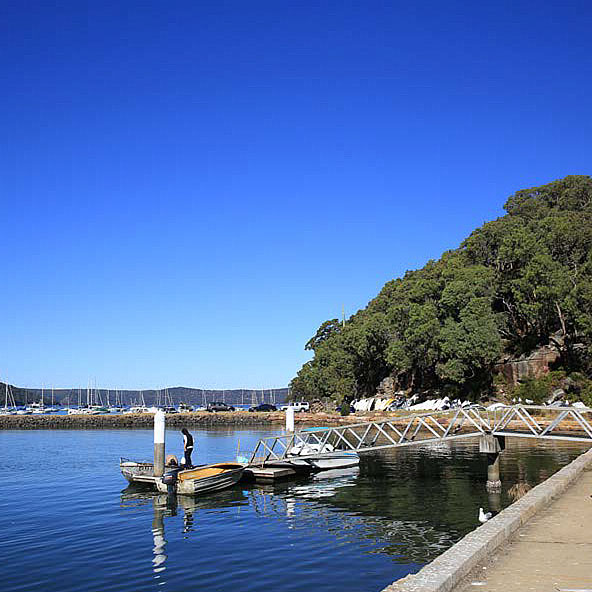 Boat and person near jetty