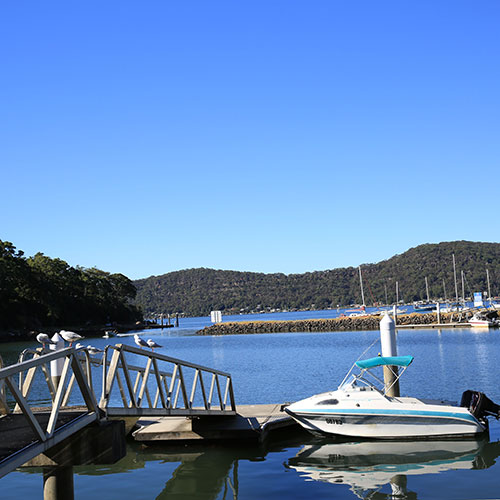 river with jetty and boat