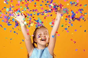 young girl with hands in the air