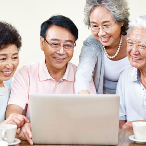 Older group looking at computer