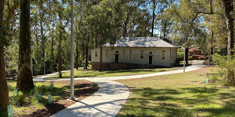 house in bushland with pathway