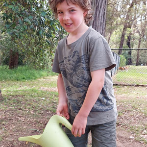 boy watering ground